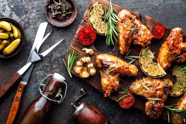 istock grilled chicken wings with vegetables, barbecue appetizer 1138015649