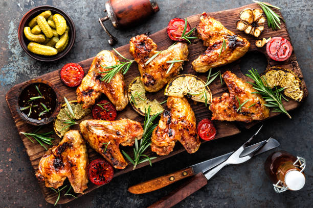 istock grilled chicken wings with vegetables, barbecue appetizer 1138015699