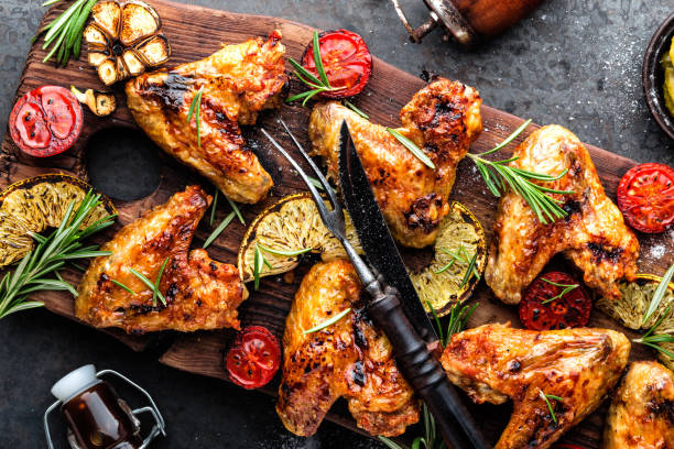 istock grilled chicken wings with vegetables, barbecue appetizer 1138015936