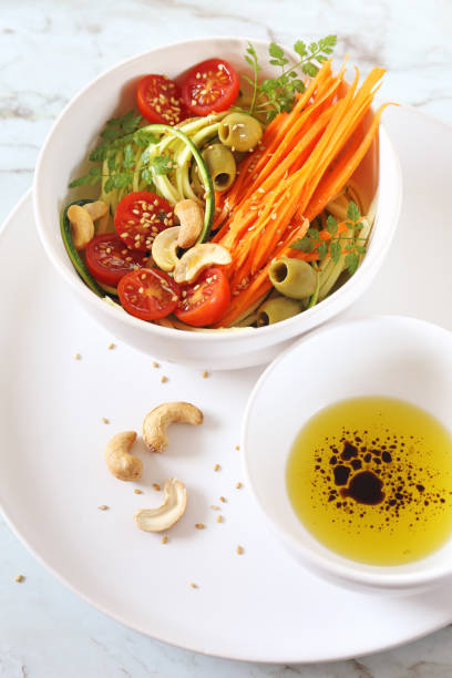 istock Vegetarian cuisine: raw zucchini and carrot spaghetti salad 1138016971