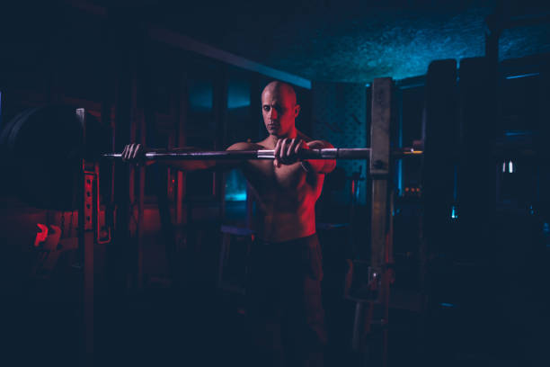 istock Shirtless bodybuilder working out at the gym 1138018821