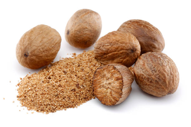 istock Whole and grated nutmeg isolated on white 1138019832
