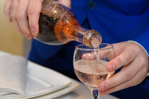 istock A man pours wine into a glass. 1138021500