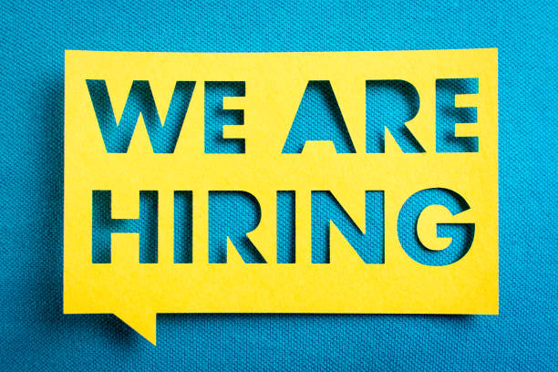 Concept of recruitment and job search. "We are hiring" yellow banner on blue textured background. Job board design, template. Concept of recruitment and job search. "We are hiring" yellow banner on blue textured background. Job board design, template. help wanted sign photos stock pictures, royalty-free photos & images