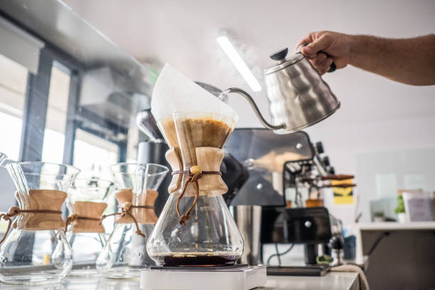 Barista Making Coffee in Glass Carafe