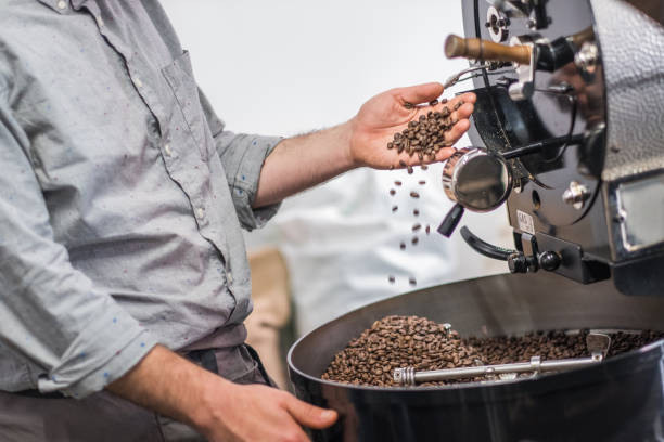 istock Hipster Barista Roasting Raw Coffee Beans 1138025417