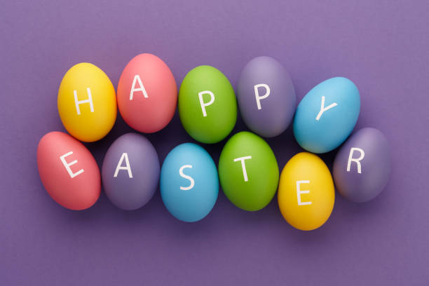 painted eggs arranged in happy easter greeting - easter text single word paint imagens e fotografias de stock