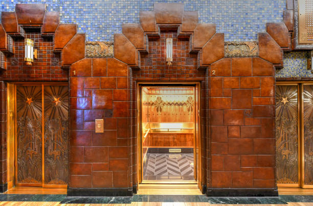 Marine Building skyscraper -  Vancouver, Canada Vancouver, Canada - September 28, 2018: Closeup of the art deco style elevators in the public lobby of the old 1930 Marine Building skyscraper in downtown Vancouver, Canada. art deco photos stock pictures, royalty-free photos & images