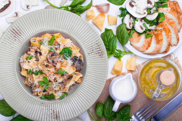 Pasta with white mushrooms stock photo