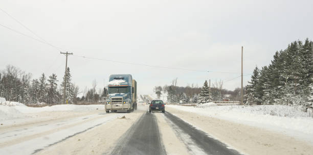 istock winter driving - oncoming blue transport 1138029552