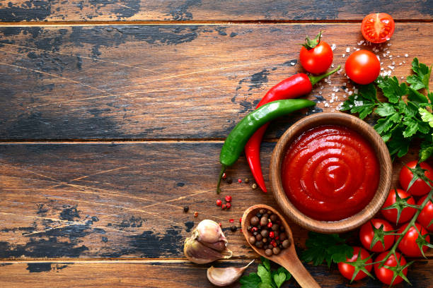 istock Fresh homemade ketchup with ingredients for making 1138032000