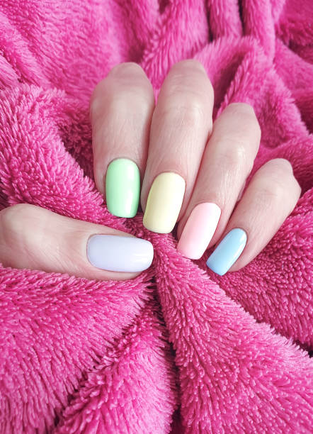 istock female hand manicure color fur 1138033263