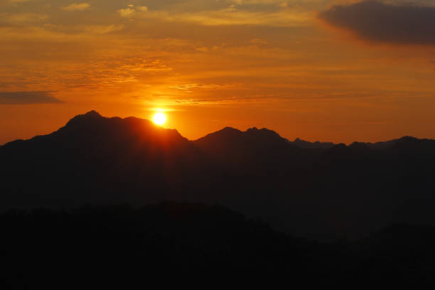 istock beautiful sunrise over the hill 1138037996