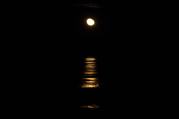 istock Moon rising over frozen lake 1138038046