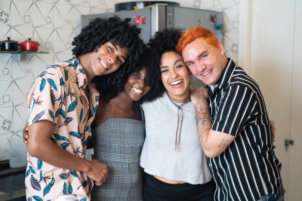 Friends Portrait at Home Social Gathering - Weekend memories with friends queer man facing camera stock pictures, royalty-free photos & images