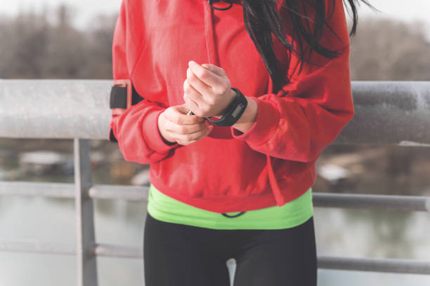 istock Sporty girl with pedometer 1138043425