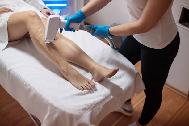 istock Beautician removing hair with laser epilator 1138044516