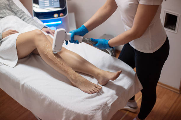 istock Beautician removing hair with laser epilator 1138044557