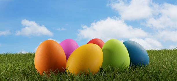 istock easter eggs green grass field and blue sky 3d-illustration 1138045917