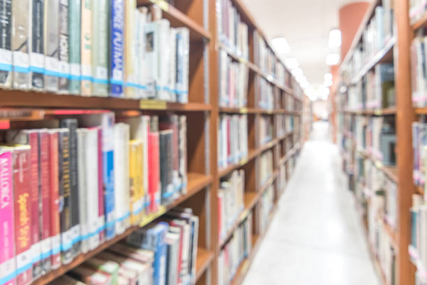istock Blur school library or study room with book shelves for education background 1138048481