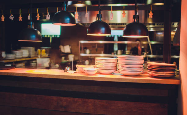 istock Group of white plates stacked together in the table. 1138048944