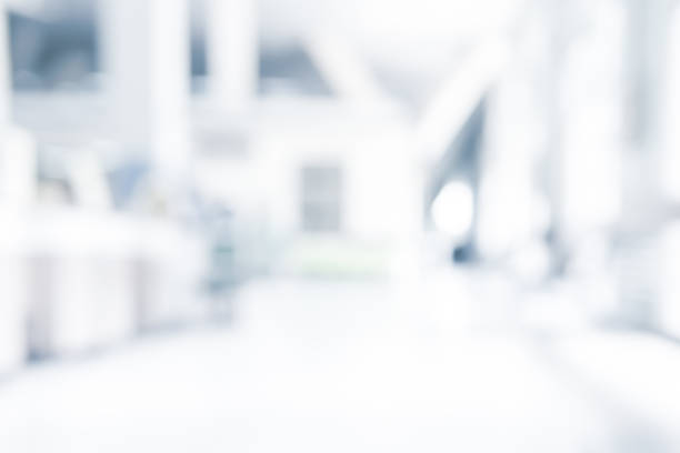 istock Abstract blurred white doctor medical office room background concept for blur empty space grey modern hospital clinic pharmacy, light clean interior retail sale, blue glare window hallway building 1138049168