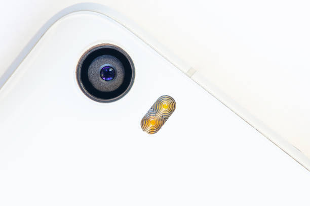 istock back camera and flash of a white glass smartphone, macro 1138051433