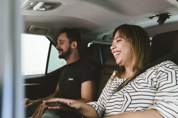 istock Smiling couple in the back seat 1138054814