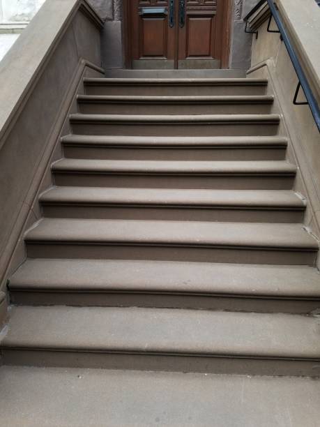 istock Brownstone steps of apartment building 1138058740