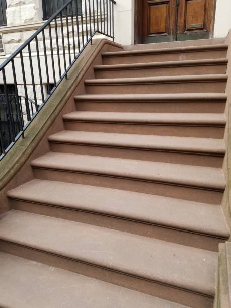 istock Brownstone steps of apartment building 1138058772