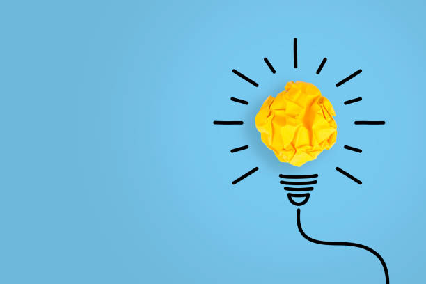 istock Idea Concepts Light Bulb Crumpled Paper on Blue Background 1138059025