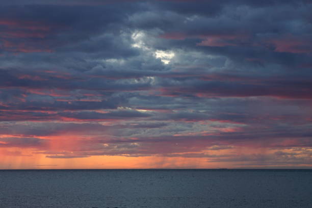 istock Dramatic rainy cloudy sky over the sea 1138069853