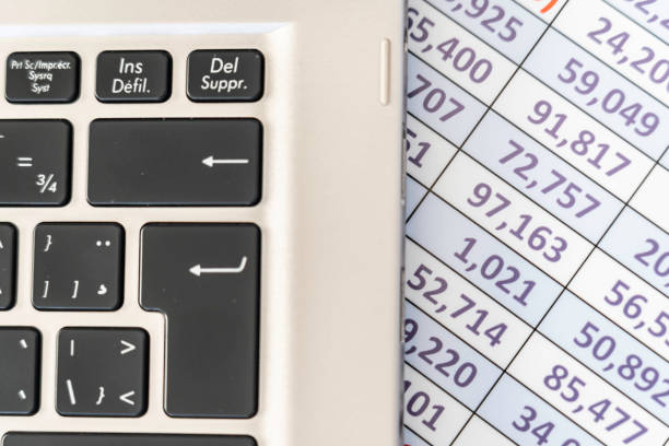 istock laptop keyboard with spreadsheet in the background 1138070865