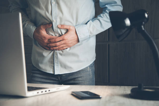 istock Businessman Has Stomach Ache  in working room 1138071045