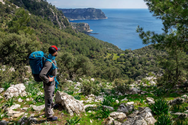 istock Only man hiking on the Karia Road with sea side. 1138075268