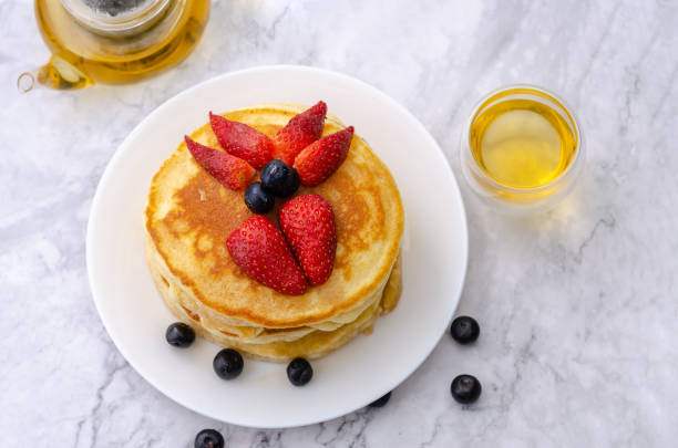 istock Pancakes with strawberry and blueberry on top 1138075459