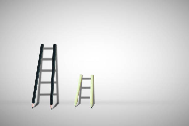 istock Business Idea and Competition Concept : Short and long ladder lean on gray wall. 1138077299