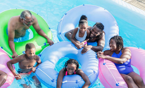 istock Multi-generation family at water park on lazy river 1138078382