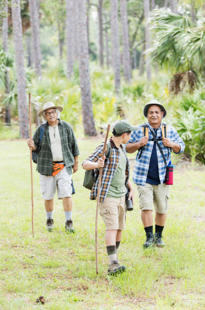 istock Multi-generation Hispanic family hiking in woods 1138079278