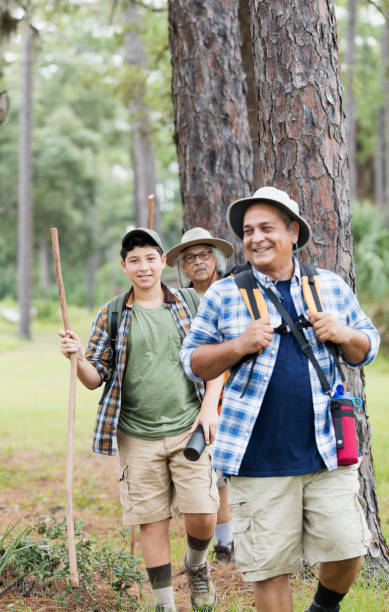 istock Multi-generation Hispanic family hiking in woods 1138079319