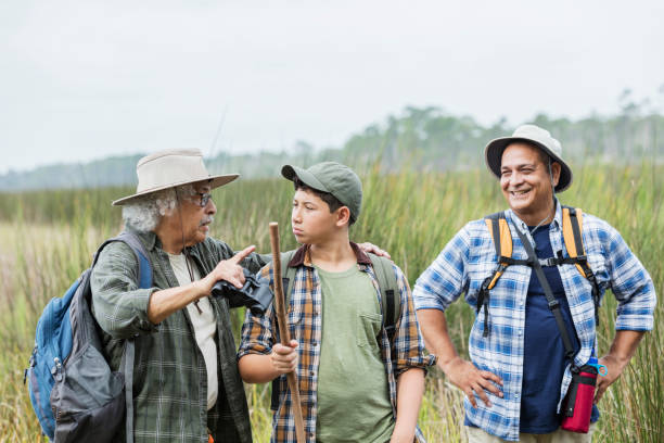 istock Multi-generation Hispanic family hiking in park 1138079388