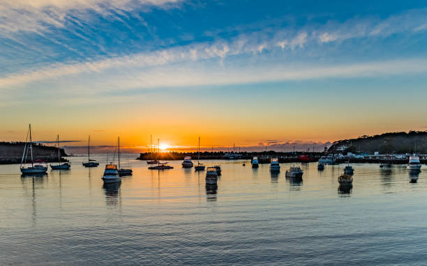 Sunrise and boats in the harbour stock photo