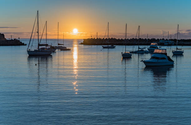 istock Sunrise and boats in the harbour 1138079487