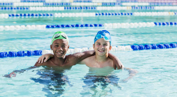 istock Multi-ethnic boys, best friends in swimming pool 1138080262