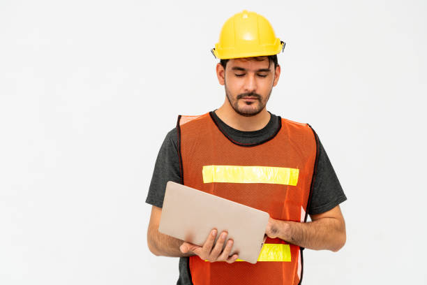 istock Young male handsome construction worker standing on white background. Civil engineering concept. 1138081705