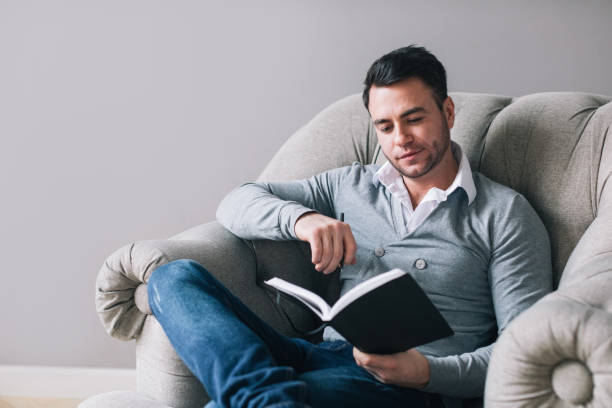 istock Man are sitting on chair using pen writing. 1138084935