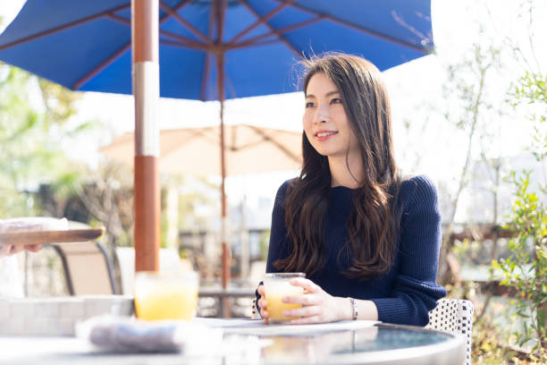 istock Woman Spending Holiday At Cafe On Open Terrace 1138085854