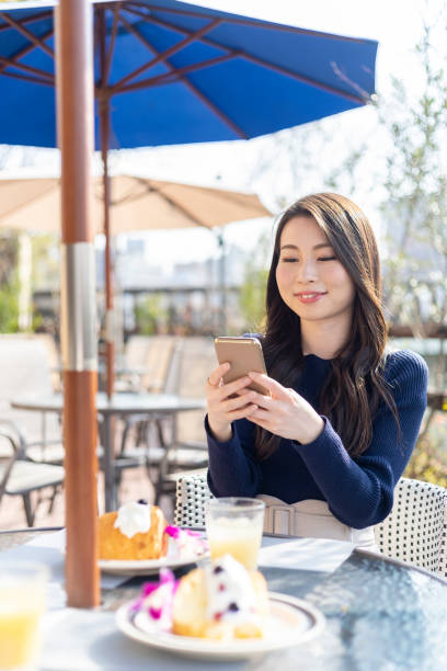 istock Woman Spending Holiday At Cafe On Open Terrace 1138085915