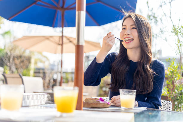 istock Woman Spending Holiday At Cafe On Open Terrace 1138085936