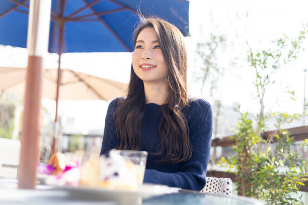 istock Woman Spending Holiday At Cafe On Open Terrace 1138085972